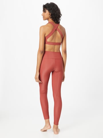 Onzie Skinny Workout Pants in Red