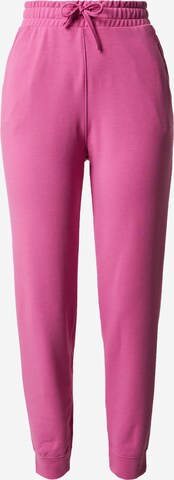 Effilé Pantalon de sport NIKE en rose : devant