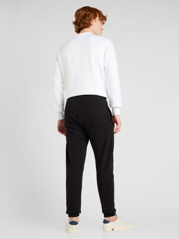 Tommy Jeans - Tapered Calças em preto