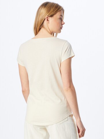 Tricou de la Sisley pe bej