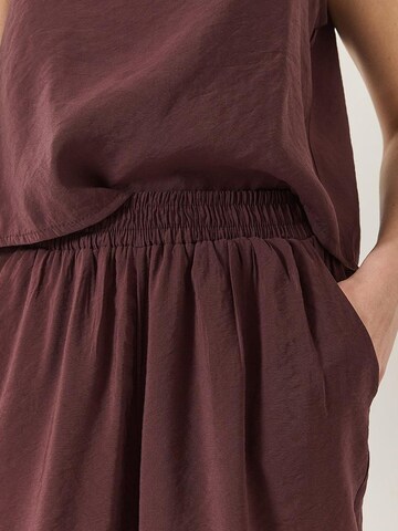 Completo pantalone di Bianco Lucci in lilla