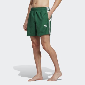 ADIDAS ORIGINALS Swimming shorts in Green: front