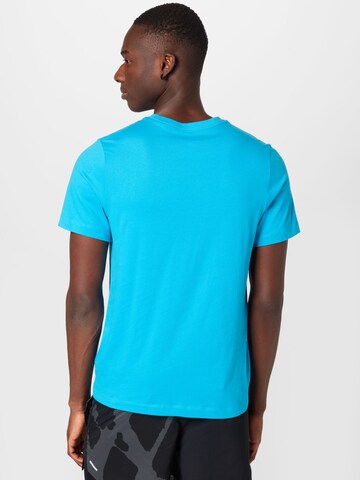 Coupe regular T-Shirt fonctionnel NIKE en bleu