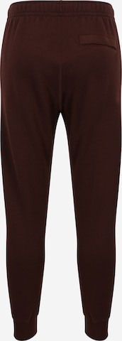 Tapered Pantaloni 'Club Fleece' de la Nike Sportswear pe maro