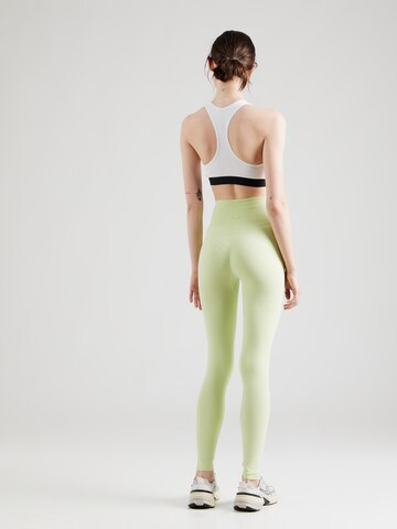 Skinny Pantaloni sportivi di Aim'n in verde