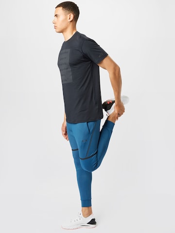 Effilé Pantalon de sport OAKLEY en bleu