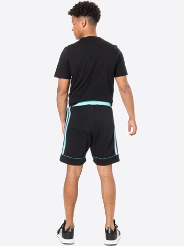 ADIDAS SPORTSWEAR - Regular Calças de desporto 'Donovan Mitchell' em preto