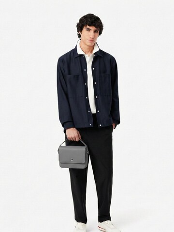 LACOSTE Crossbody bag 'Lacoste Petit sac messenger Homme Langon Petit Piqué' in Black: front