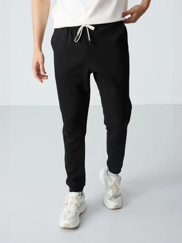 Tuta da jogging di Tommy Life in beige