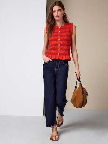 Haut Next en rouge