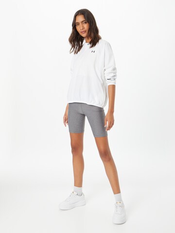 Skinny Pantaloni sportivi di UNDER ARMOUR in grigio