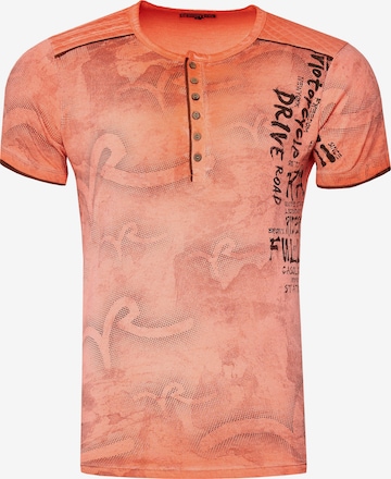 Rusty Neal T-Shirt mit lässigem Allover-Print in Orange: predná strana