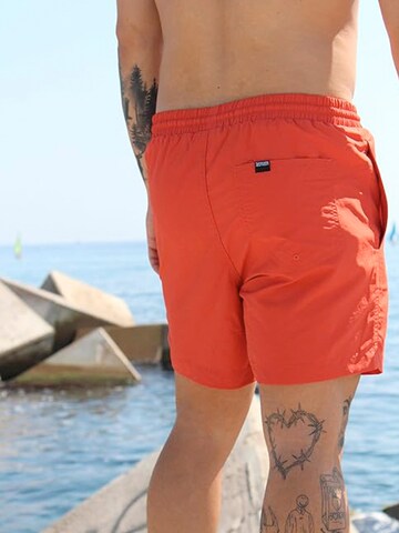 Boardshorts Surf Monkey en rouge