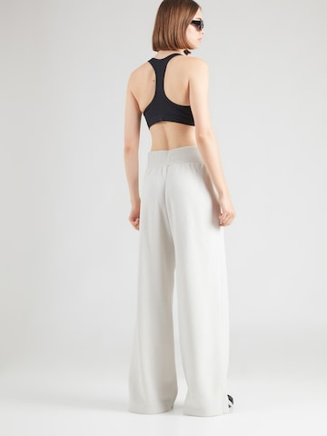 Nike Sportswear Wide leg Broek 'PHNX' in Beige: terug