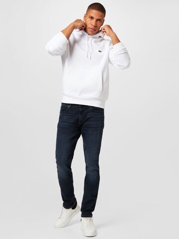 LACOSTE Sweatshirt i vit