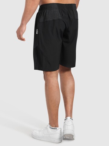 Regular Pantalon de sport Smilodox en noir