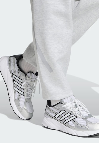 ADIDAS SPORTSWEAR Zúžený strih Športové nohavice 'Z.N.E.' - Sivá