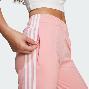 ADIDAS ORIGINALS Bő szár Nadrág 'Adicolor' - rózsaszín