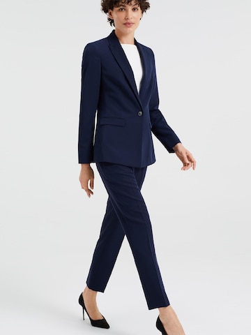 WE Fashion Slimfit Kalhoty s puky – modrá
