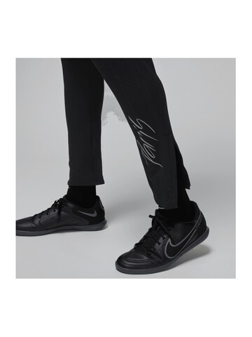 NIKE Slim fit Weatherproof pants in Black
