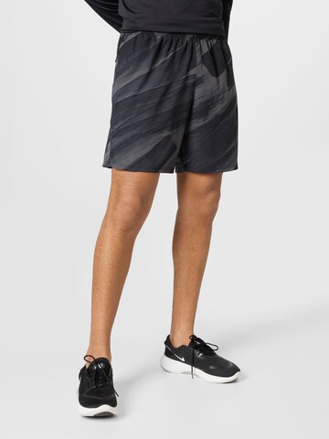 NIKE Regular Workout Pants in Black: front