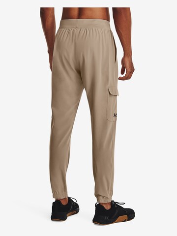 UNDER ARMOUR Tapered Sportbroek in Beige