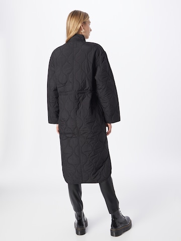 Neo Noir Between-Seasons Coat in Black: front