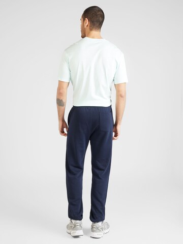 Champion Authentic Athletic Apparel Дънки Tapered Leg Панталон в синьо