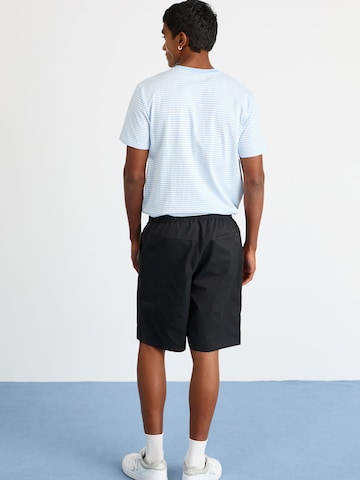 ELLESSE Loose fit Trousers 'Cagola' in Black