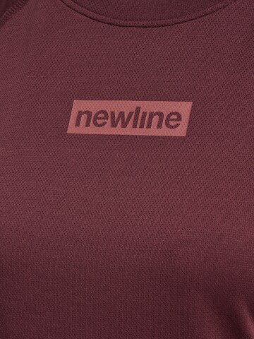 Newline Functioneel shirt 'CHARGE' in Bruin