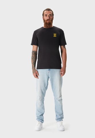 Oldskull Shirt 'Wrldvibe Return to Wild Graphic' in Black