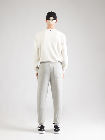 Tapered Pantaloni sportivi 'ESSENTIAL 4' di BJÖRN BORG in grigio