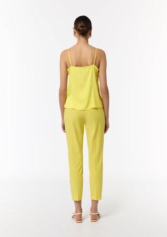 Top di COMMA in giallo: dietro