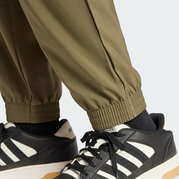 ADIDAS SPORTSWEAR Tapered Sports trousers 'Essentials' in Green