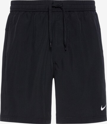 NIKE Sports trousers in Black: front