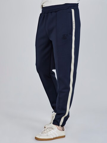 Slimfit Pantaloni sportivi di SikSilk in blu