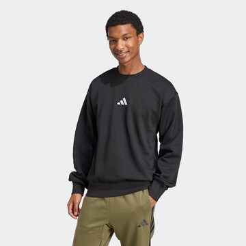 ADIDAS SPORTSWEAR Sportsweatshirt 'FEELCOZY' in Schwarz: Vorderseite