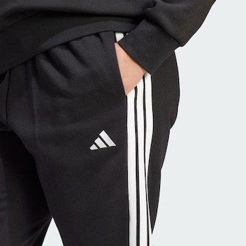 ADIDAS SPORTSWEAR Tapered Sports trousers 'Essentials' in Black
