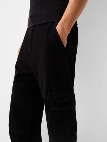 Bershka Loose fit Cargo jeans in Black