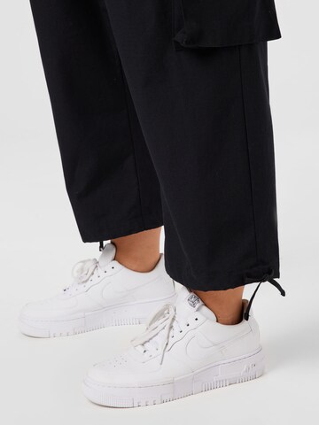 Nike Sportswear Loosefit Hose 'Icon Clash' in Schwarz