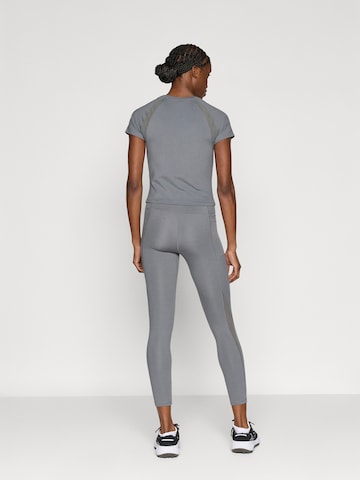 UNDER ARMOUR Skinny Sporthose 'Motion' in Grün