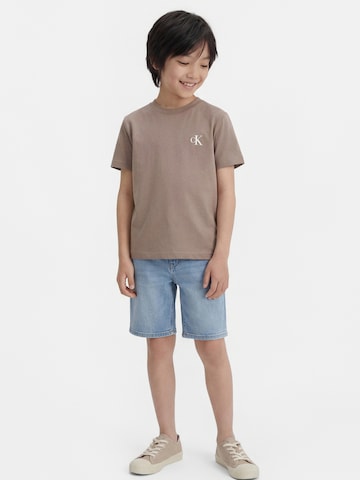 Calvin Klein JeansMajica - žuta boja: prednji dio