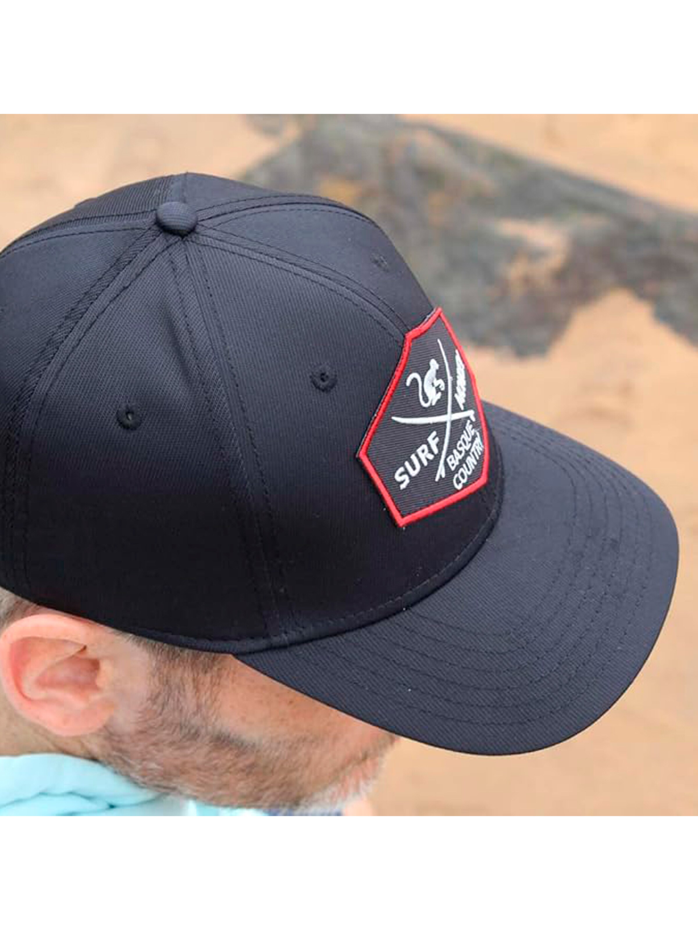 Cappello da baseball sportivo di Surf Monkey in nero