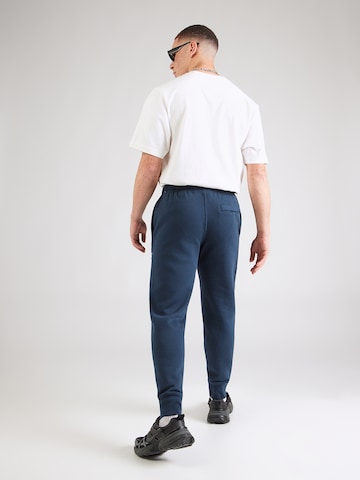 Nike Sportswear Tapered Byxa 'CLUB' i blå