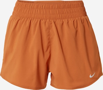 NIKE Regular Sports trousers in Brown: front