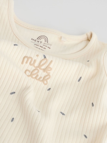 Next Sparkdräkt/body i beige