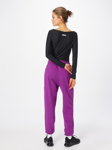 Effilé Pantalon de sport NIKE en rose