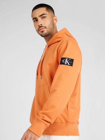 Calvin Klein Jeans Свитшот в Оранжевый