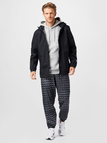 juoda ADIDAS ORIGINALS Siaurėjantis Kelnės