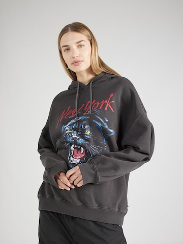 Tommy Jeans Zip-Up Hoodie in Black: front